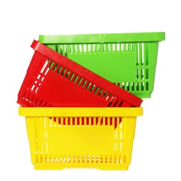 Photo of Stack of colorful shopping baskets isolated on white