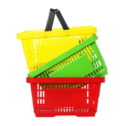 Photo of Stack of colorful shopping baskets isolated on white