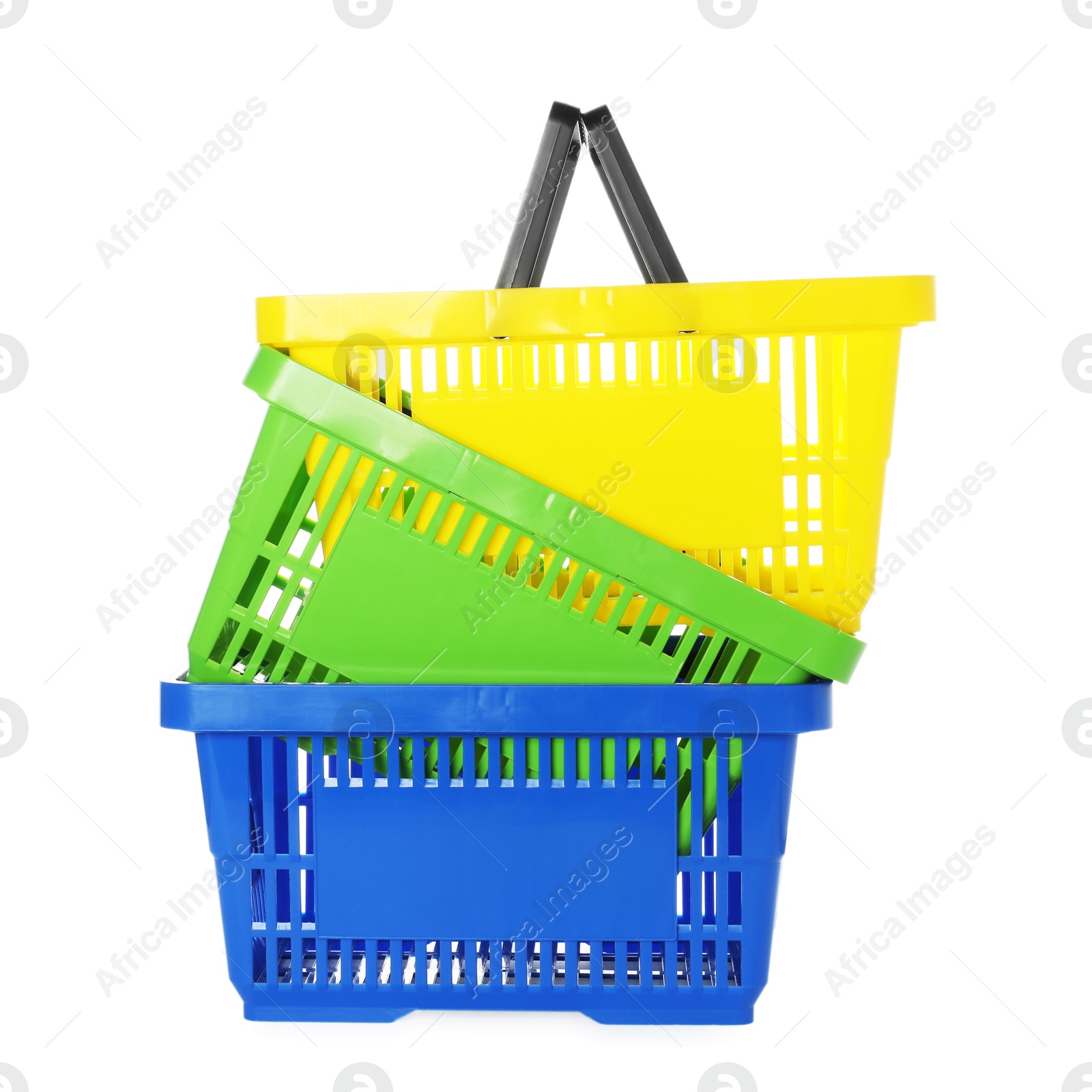 Stack of colorful shopping baskets isolated on white Photo of Stack of colorful shopping baskets isolated on white
