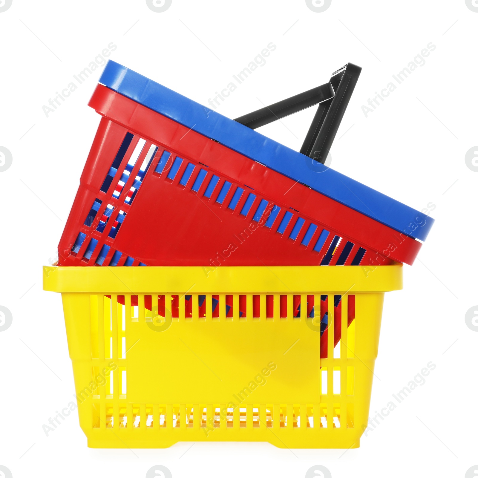 Stack of colorful shopping baskets isolated on white Photo of Stack of colorful shopping baskets isolated on white