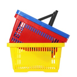 Photo of Stack of colorful shopping baskets isolated on white