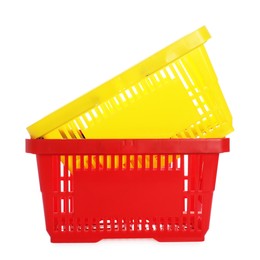 Photo of Stack of colorful shopping baskets isolated on white