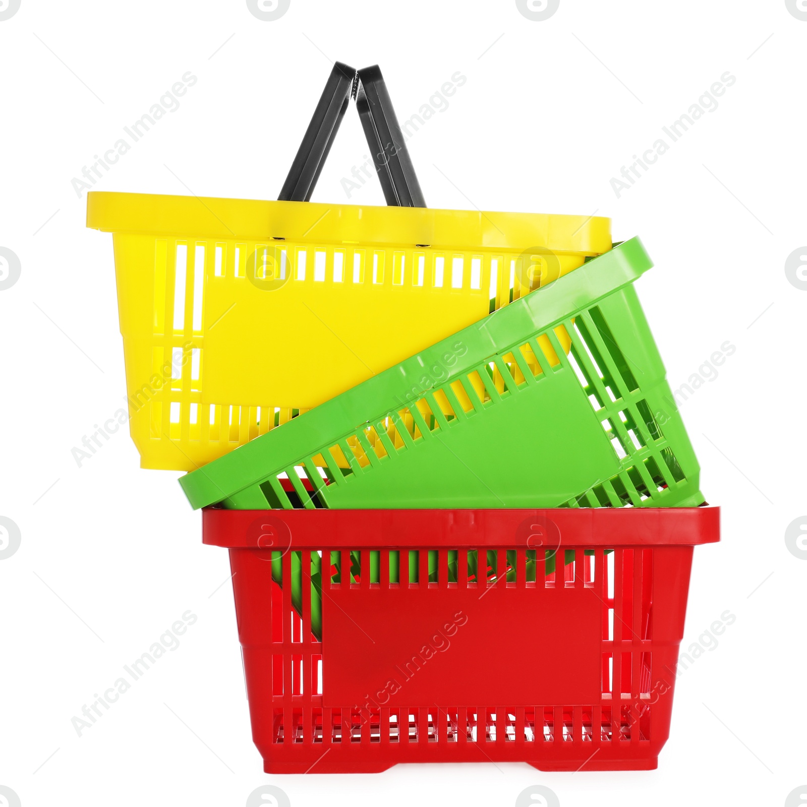 Stack of colorful shopping baskets isolated on white Photo of Stack of colorful shopping baskets isolated on white