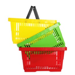 Photo of Stack of colorful shopping baskets isolated on white