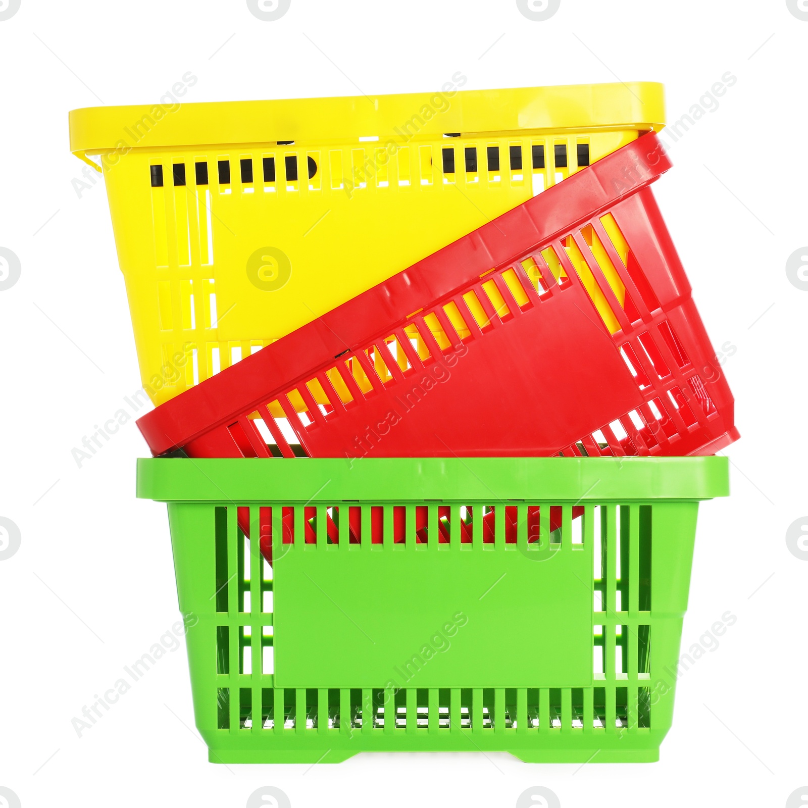 Stack of colorful shopping baskets isolated on white Photo of Stack of colorful shopping baskets isolated on white