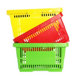 Photo of Stack of colorful shopping baskets isolated on white