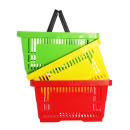 Photo of Stack of colorful shopping baskets isolated on white