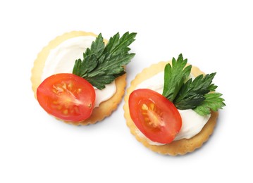 Photo of Tasty crackers with cream cheese, tomatoes and parsley isolated on white, top view