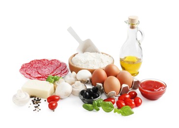 Photo of Making pizza. Different ingredients isolated on white