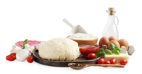 Photo of Making pizza. Different ingredients isolated on white