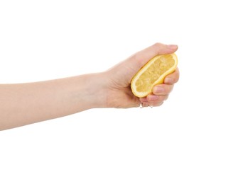 Photo of Woman squeezing lemon on white background, closeup