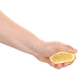 Photo of Woman squeezing lemon on white background, closeup