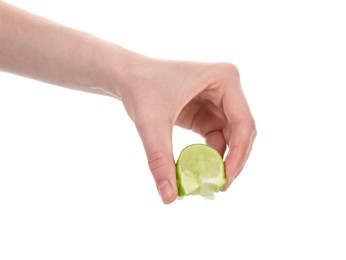 Photo of Woman squeezing lime on white background, closeup