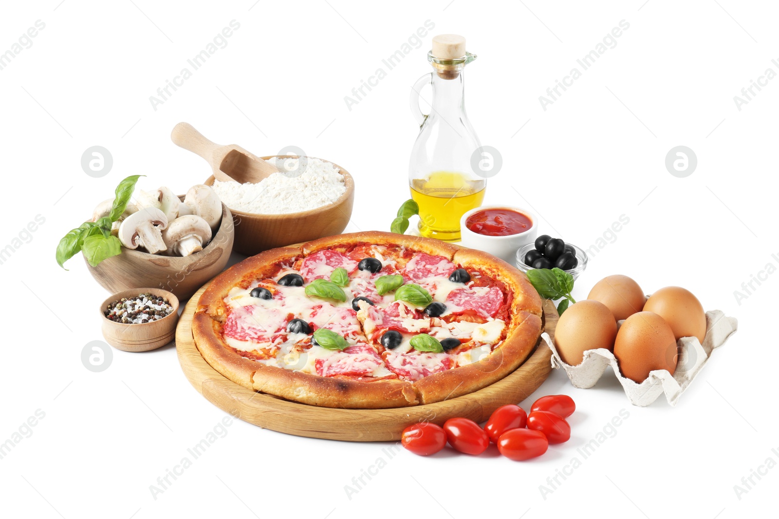 Tasty pizza and ingredients isolated on white Photo of Tasty pizza and ingredients isolated on white