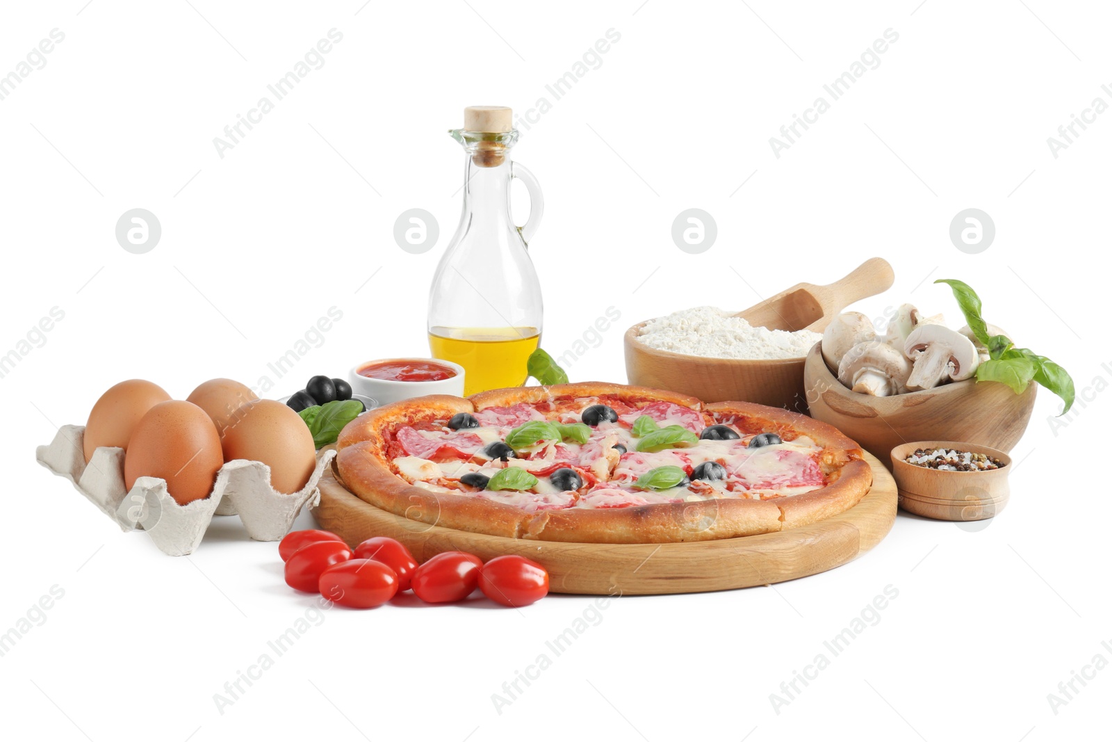 Tasty pizza and ingredients isolated on white Photo of Tasty pizza and ingredients isolated on white