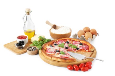 Photo of Tasty pizza and ingredients isolated on white