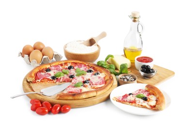 Photo of Tasty pizza and ingredients isolated on white