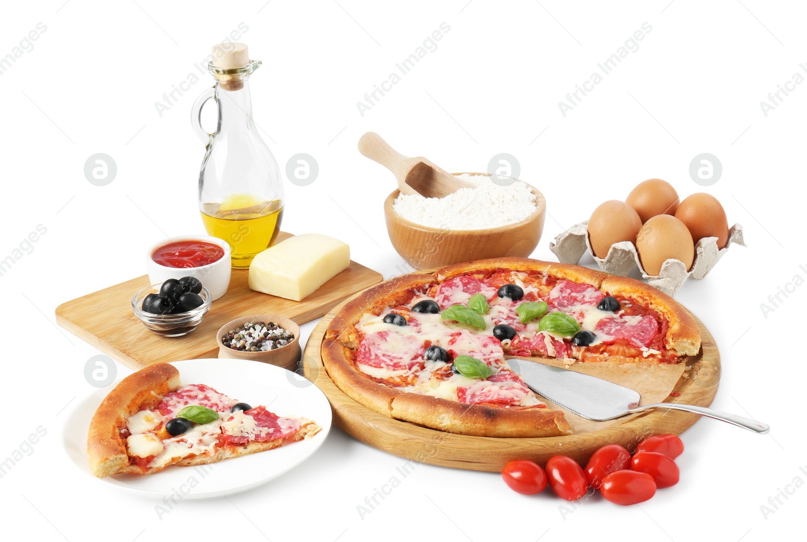 Tasty pizza and ingredients isolated on white Photo of Tasty pizza and ingredients isolated on white