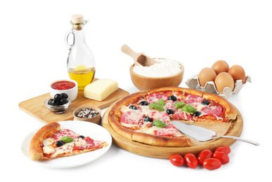 Photo of Tasty pizza and ingredients isolated on white