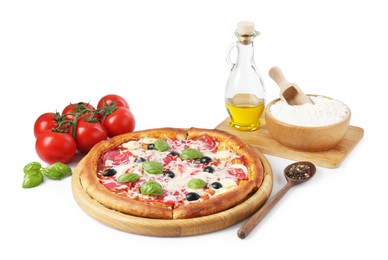 Photo of Tasty pizza and ingredients isolated on white