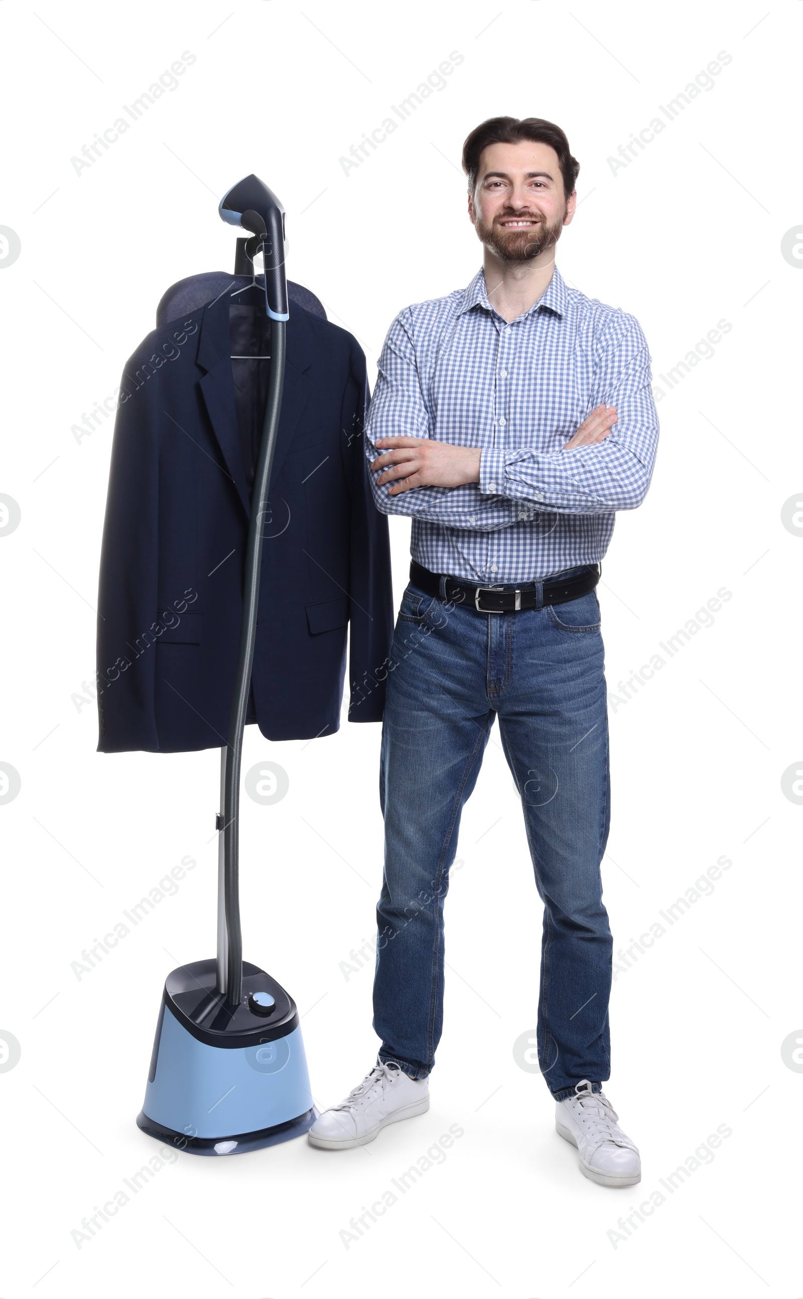 Man with stand steamer and jacket on white background Photo of Man with stand steamer and jacket on white background