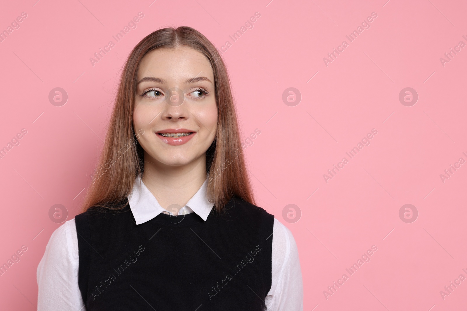 Portrait of teenage girl on light pink background. Space for text Photo of Portrait of teenage girl on light pink background. Space for text