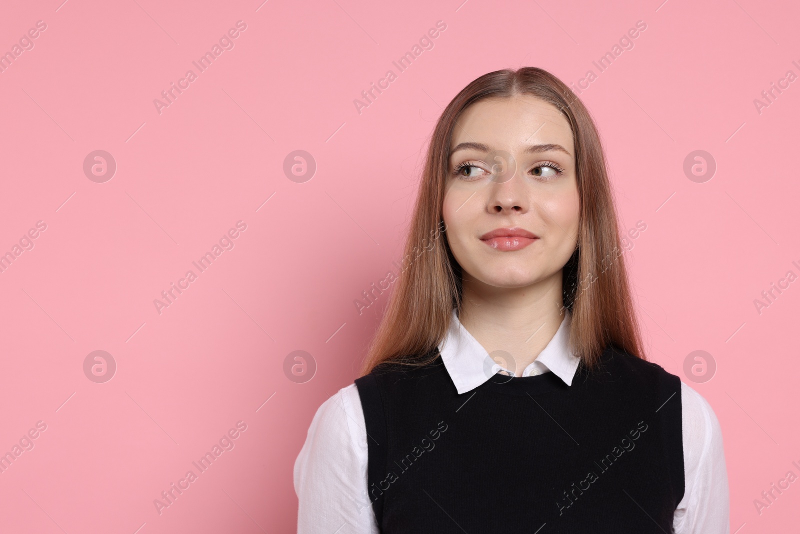 Portrait of teenage girl on light pink background. Space for text Photo of Portrait of teenage girl on light pink background. Space for text