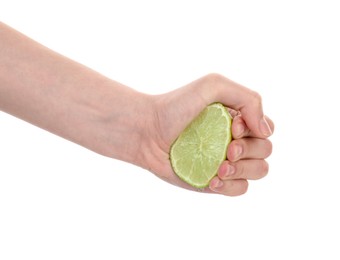 Photo of Woman squeezing lime on white background, closeup