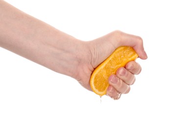 Photo of Woman squeezing orange on white background, closeup