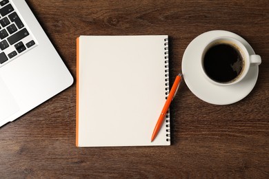 Photo of Notebook, pen, coffee and laptop on wooden table, flat lay