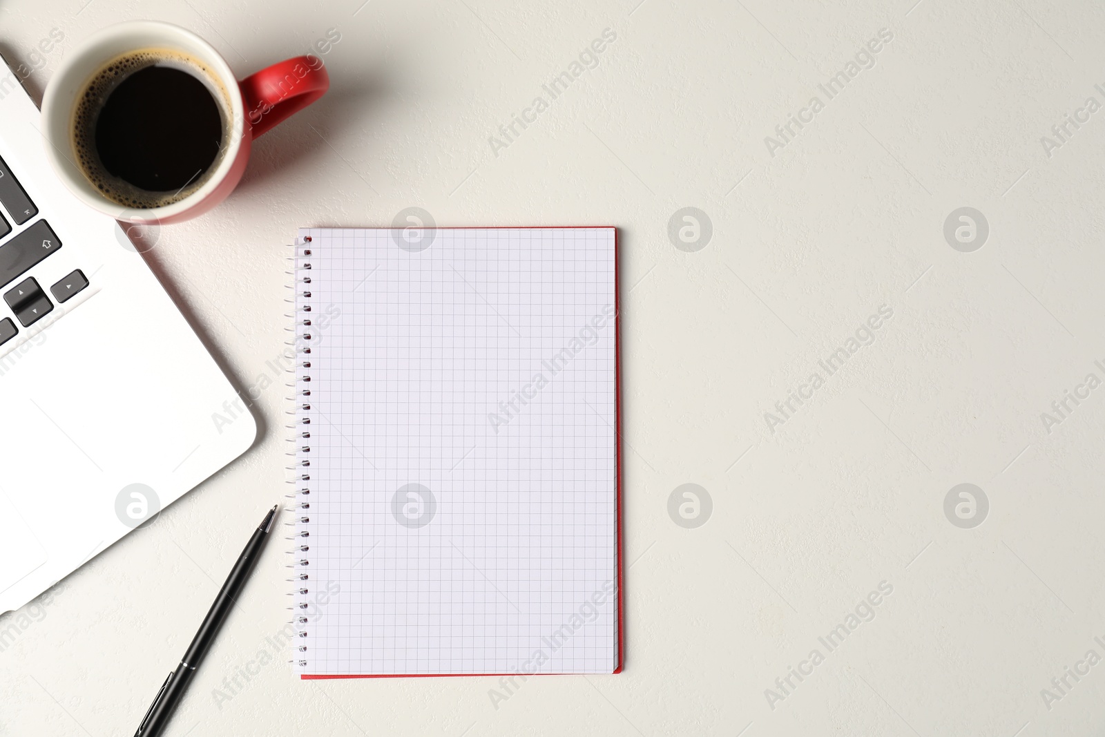 Notebook, pen, coffee and laptop on white table, flat lay. Space for text Photo of Notebook, pen, coffee and laptop on white table, flat lay. Space for text