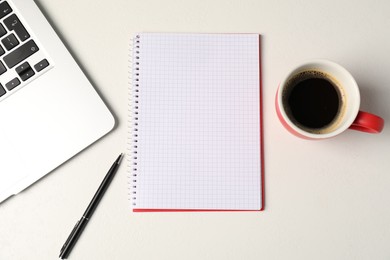 Photo of Notebook, pen, coffee and laptop on white table, flat lay