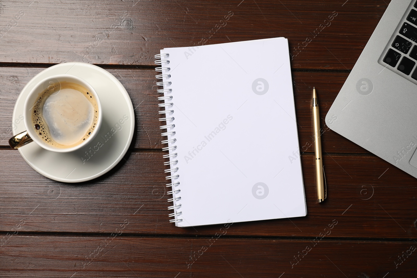 Notebook, pen, coffee and laptop on wooden table, flat lay Photo of Notebook, pen, coffee and laptop on wooden table, flat lay