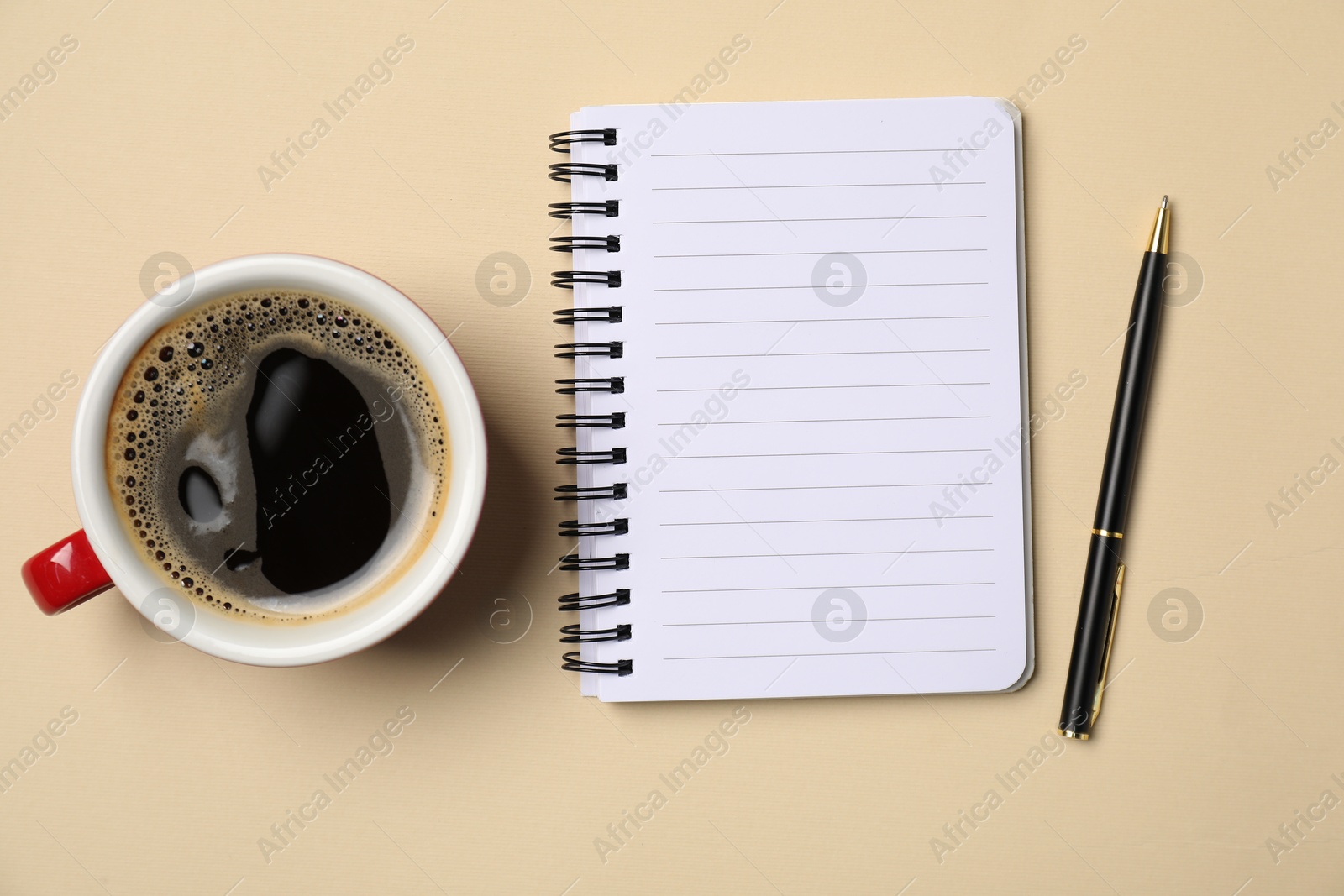 Notebook, pen and coffee on beige background, flat lay Photo of Notebook, pen and coffee on beige background, flat lay