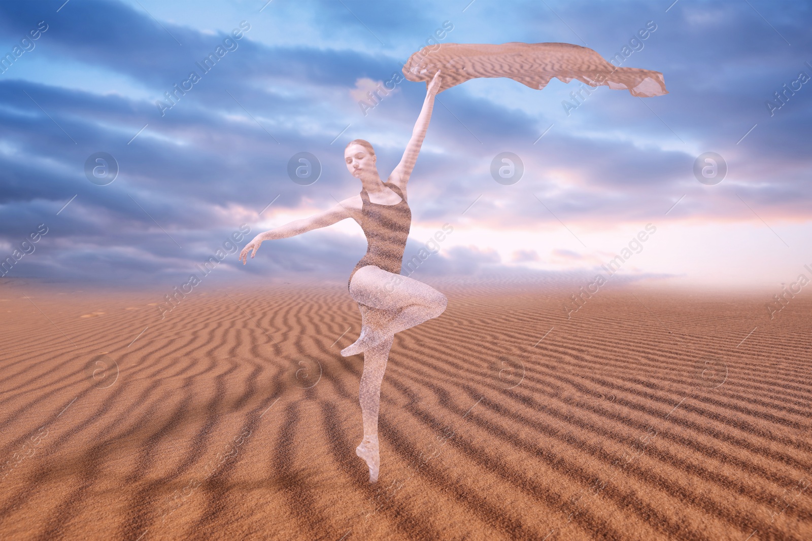 Graceful young woman with fabric dancing in desert Image of Graceful young woman with fabric dancing in desert