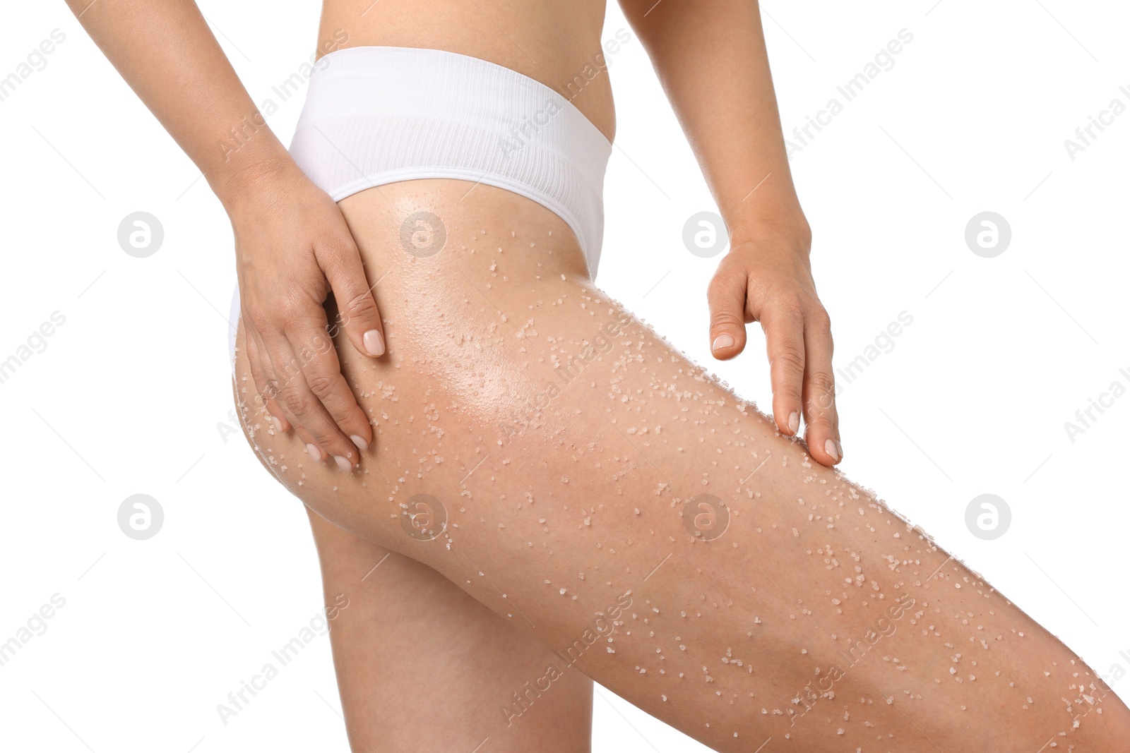 Woman with body scrub on her leg against white background, closeup Photo of Woman with body scrub on her leg against white background, closeup