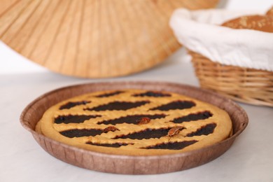 Photo of Cockroaches crawling on pie on light table, closeup