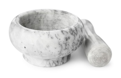 Photo of Marble mortar with pestle isolated on white