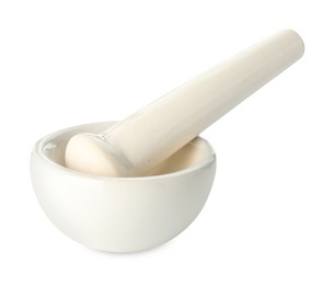 Photo of Ceramic mortar with pestle isolated on white