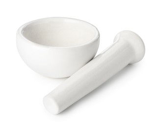 Photo of Ceramic mortar with pestle isolated on white