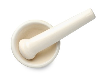 Photo of Ceramic mortar with pestle isolated on white, top view