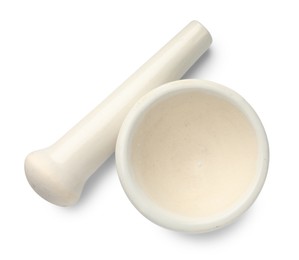 Photo of Ceramic mortar with pestle isolated on white, top view