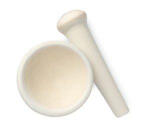 Photo of Ceramic mortar with pestle isolated on white, top view