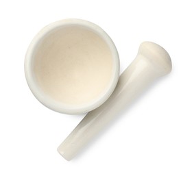 Photo of Ceramic mortar with pestle isolated on white, top view