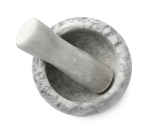 Photo of Marble mortar with pestle isolated on white, top view