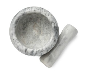Photo of Marble mortar with pestle isolated on white, top view