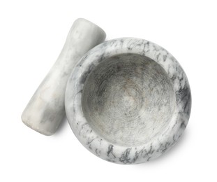 Photo of Marble mortar with pestle isolated on white, top view