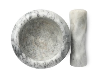 Photo of Marble mortar with pestle isolated on white, top view