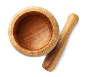 Photo of Wooden mortar with pestle isolated on white, top view