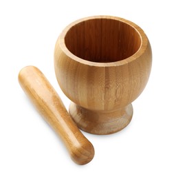 Photo of Wooden mortar with pestle isolated on white